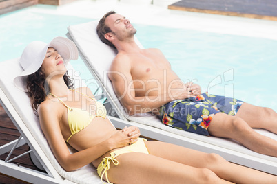 Young couple near swimming pool