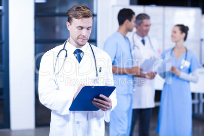 Doctor writing a medical report