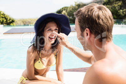 Young couple near swimming pool