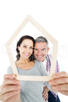 Couple holding house shape