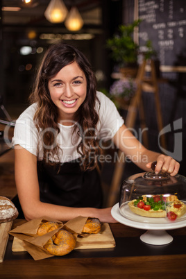 Pretty waitress behind the counter