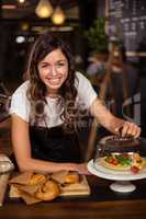 Pretty waitress behind the counter