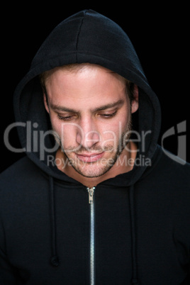 Handsome man wearing a black hoodie