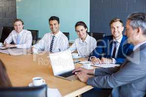 Businesspeople sitting in conference room during a meeting