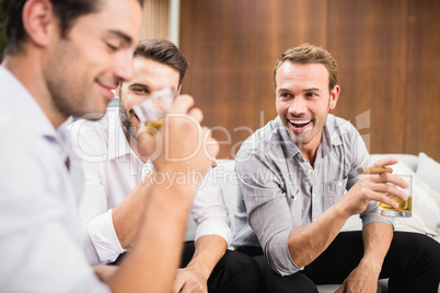 Group of men having cocktail drinks