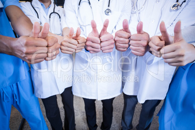 Medical team putting their thumbs up