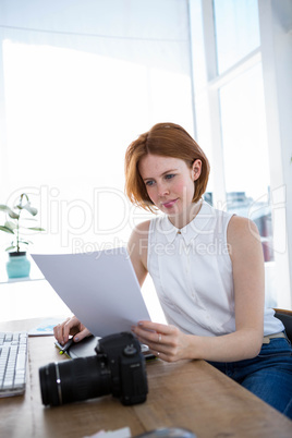 hipster business woman reading files