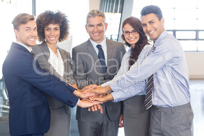 Businesspeople hands stacked over each other