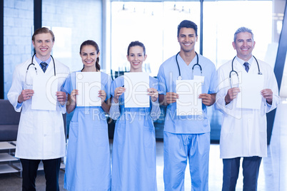 Portrait of doctors showing medical reports