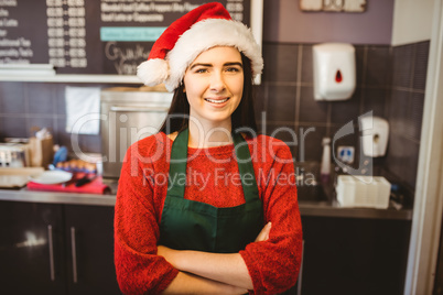 Cute waitress standing behind the counter