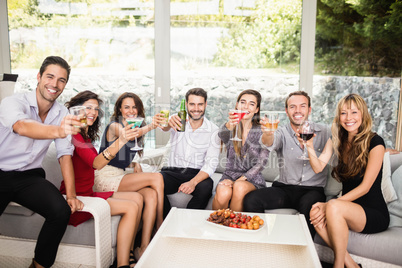 Group of friends having cocktail drinks