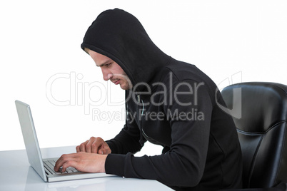 Man in black hoodie using laptop
