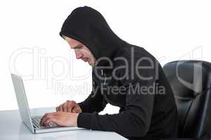 Man in black hoodie using laptop