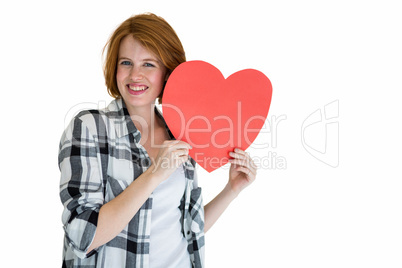 Fashion hipster holding a red heart shape