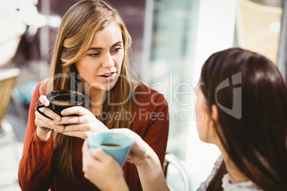 Friends chatting over coffee