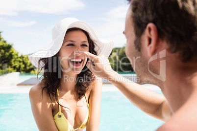 Young couple near swimming pool