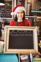 Cute waitress holding a blackboard