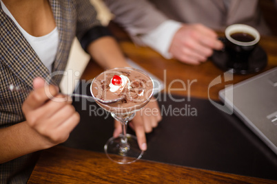 Close up of woman eating dessert