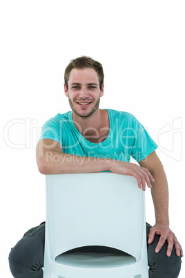 Hipster man sitting on chair