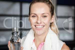 Smiling woman drinking water