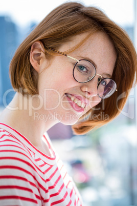 Cute red haired hipster with glasses