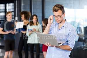 Man using a laptop in office