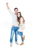 Triumphant couple raising fist