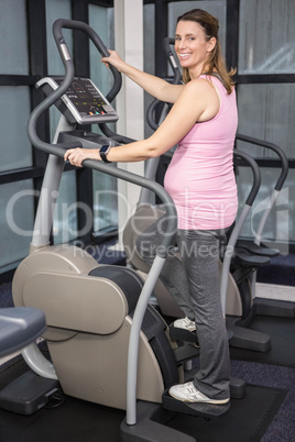 Pregnant woman on crosstrainer