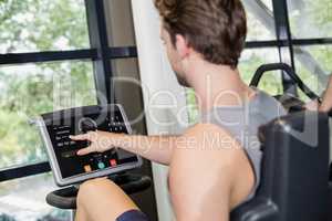 Fit man doing exercise bike