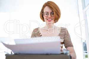 hipster typing on a typewrite