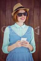 Cute red haired hipster texting