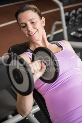 Woman exercising with dumbbells