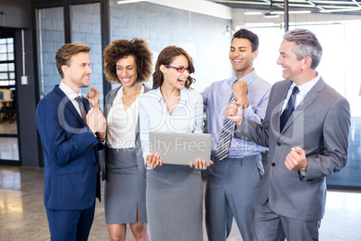 Happy business team celebrating a success