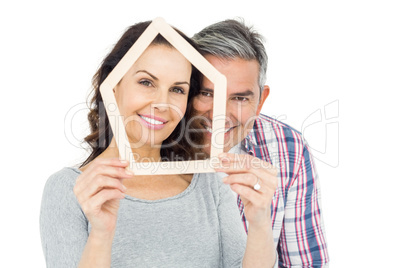 Couple holding house shape