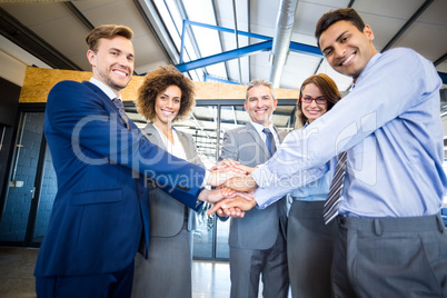 Businesspeople hands stacked over each other