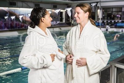 Pregnant women with bathrobe talking