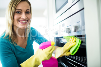 Pretty woman doing her house chores