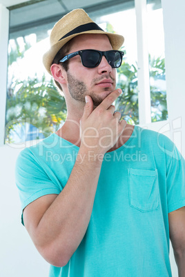 Hipster man posing with sunglasses