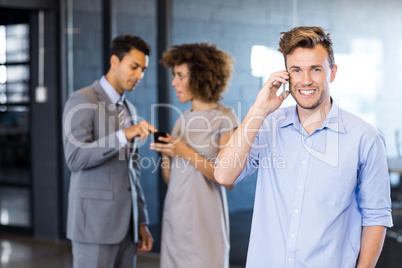 Confident executive talking on mobile phone