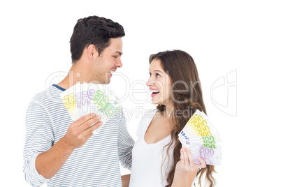 Happy couple holding money