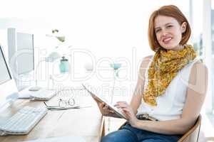 smiling hipster woman on a tablet