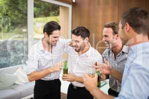 Group of young men having drinks