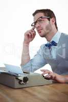 Handsome man using old fashioned typewriter