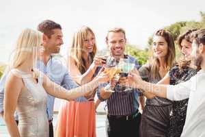 Happy young friends having drinks