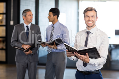 Close-up of businessman with his organizer