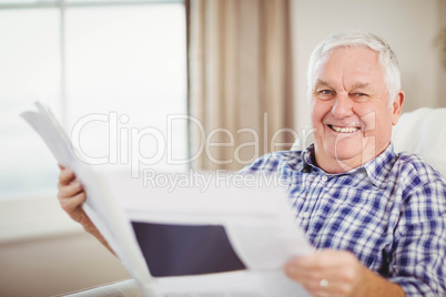 Senior man reading a newspaper