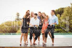 Happy young friends having drinks