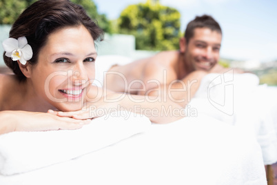 Young couple relaxing on massage table