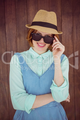 Cute red haired hipster with sunglasses