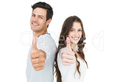 Couple standing back to back with thumbs up